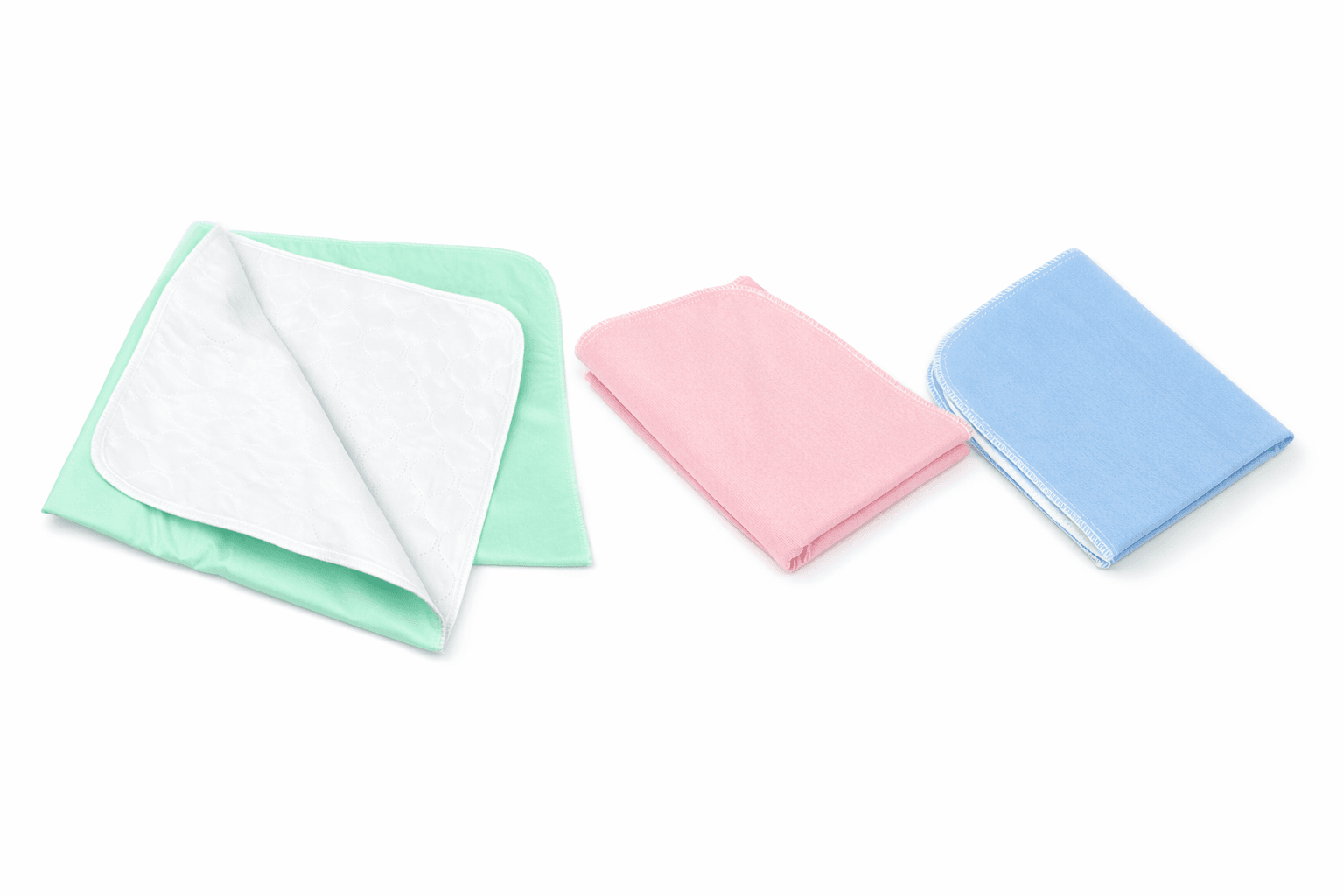 Reusable Under pads 24 x 36 inch folded in green, pink and blue.