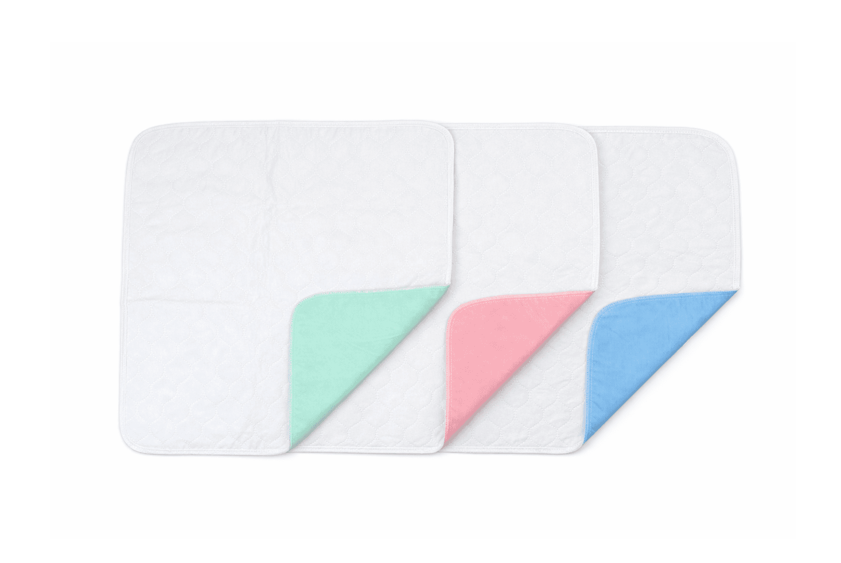 Reusable Under pads 17 x 22 inch lying flat in green, pink and blue.