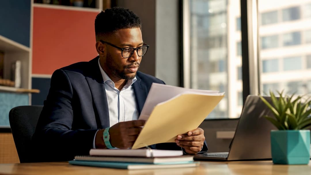 Businessman reviewing supplier documents