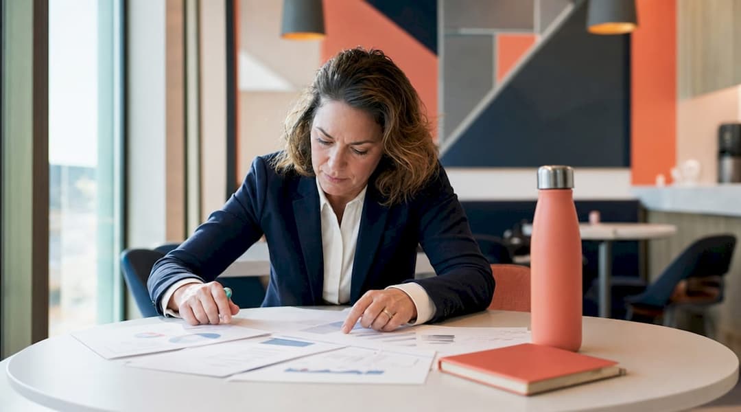 Healthcare administrator reviewing lifecycle documents